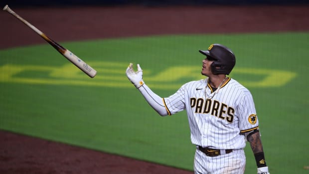 Sep 7, 2020; San Diego, California, USA; San Diego Padres third baseman Manny Machado (13) tosses his bat after grounding into a inning-ending double play during the seventh inning against the Colorado Rockies at Petco Park. Mandatory Credit: Orlando Ramirez-USA TODAY Sports